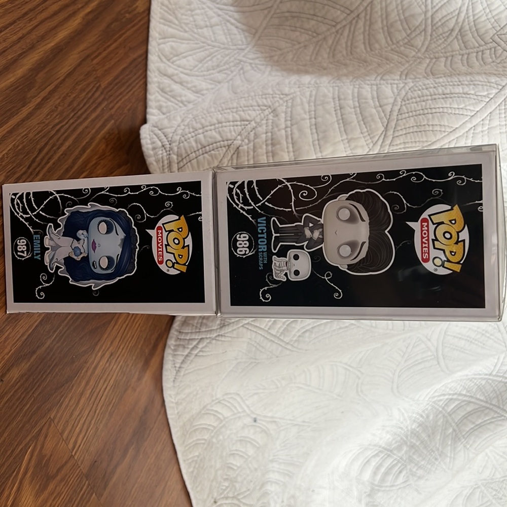 Both Emily and Victor pops. Never opened, boxes in great condition.